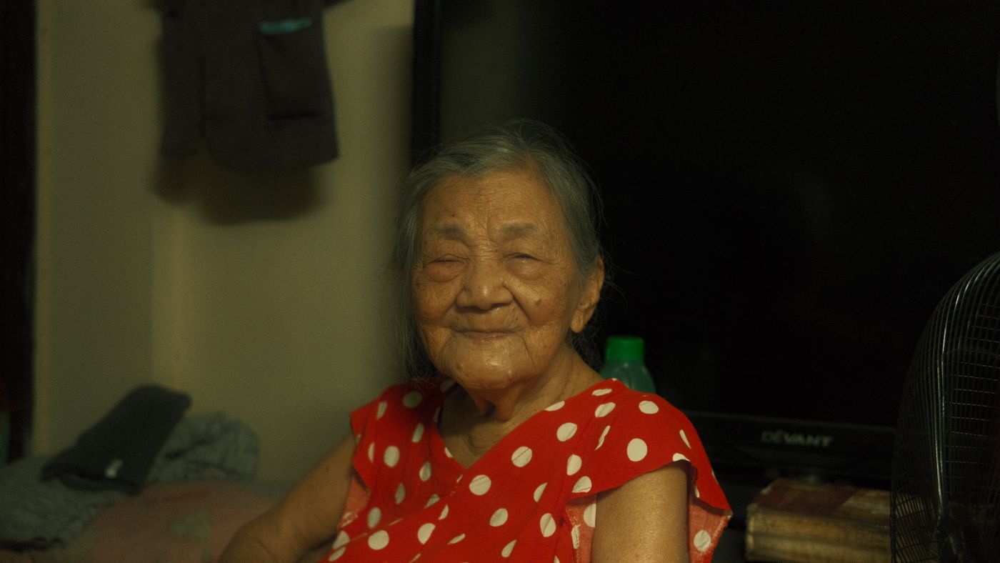 A smiling older woman relaxing at home